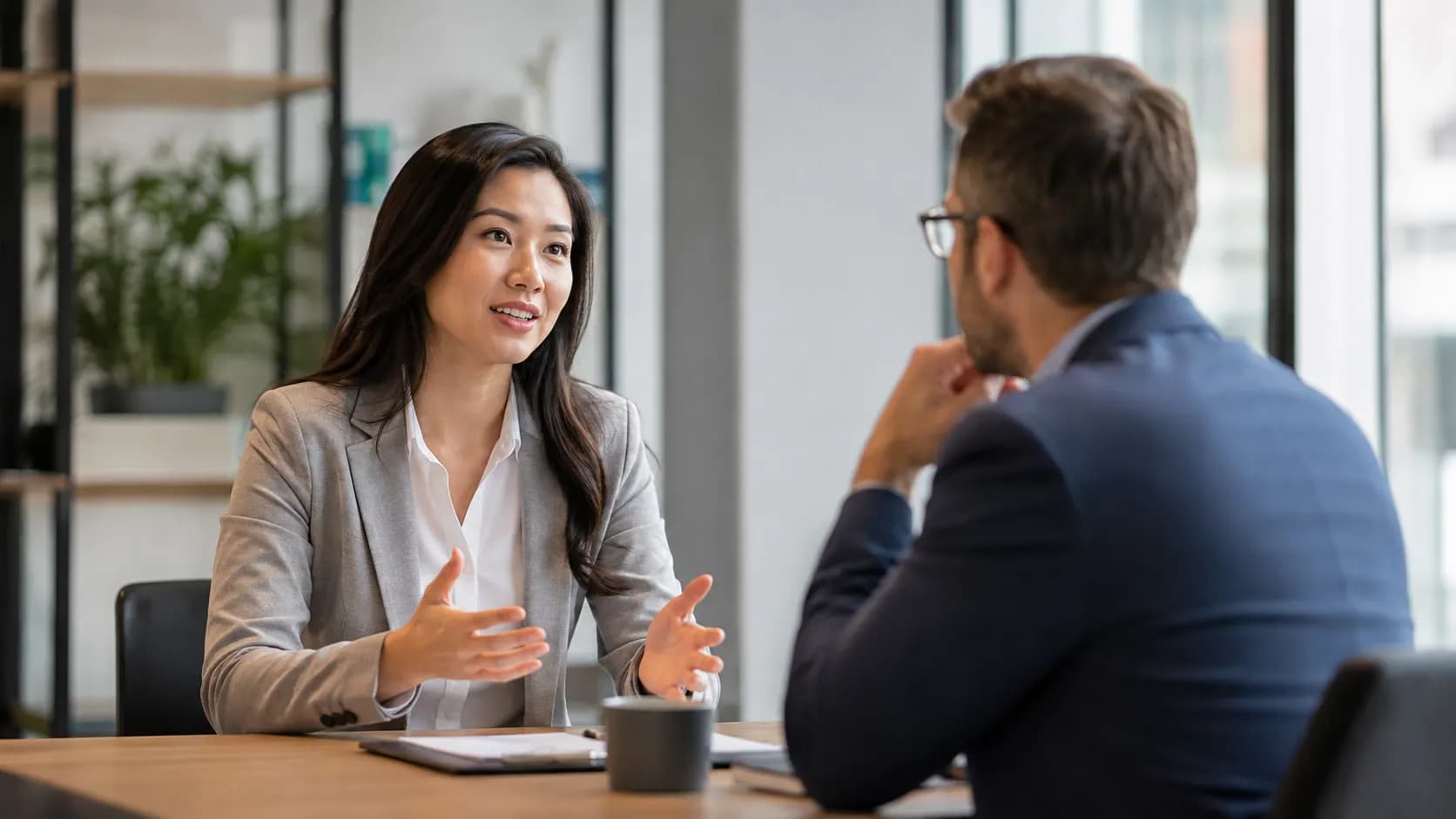 Candidate speaking naturally with an interviewer during a job interview.