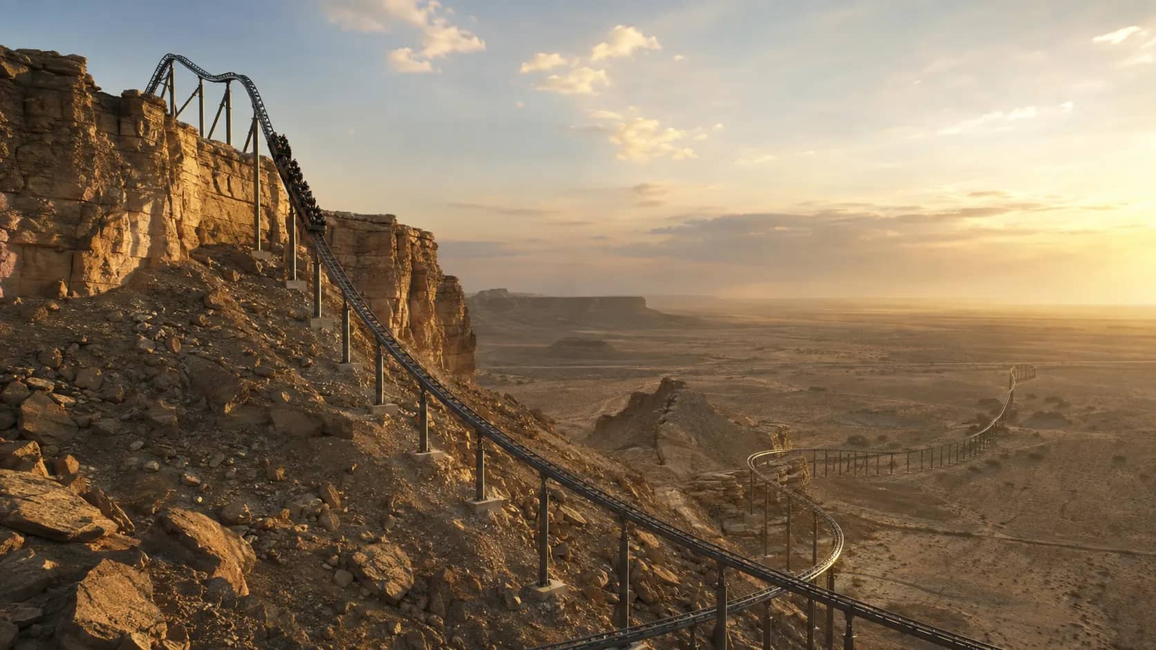 A massive roller coaster running across rocky desert cliffs at Qiddiya near Riyadh.
