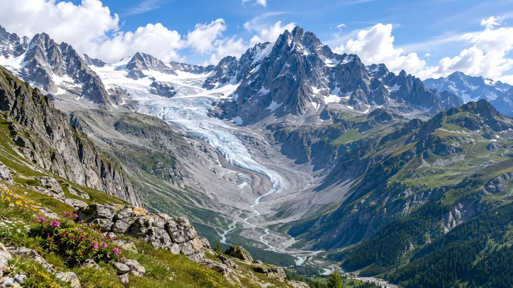A broad Alpine valley surrounded by jagged mountain peaks with a glacier descending between them.