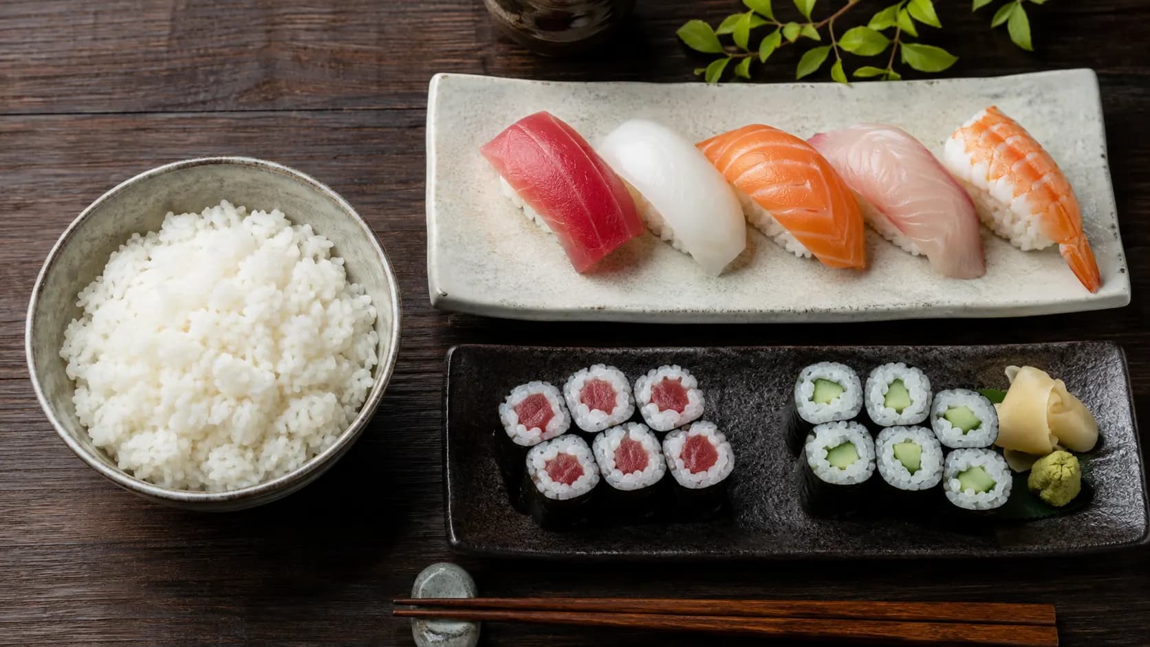 Sushi rice shown in a bowl beside several rolls and nigiri containing a similar visible amount of rice.